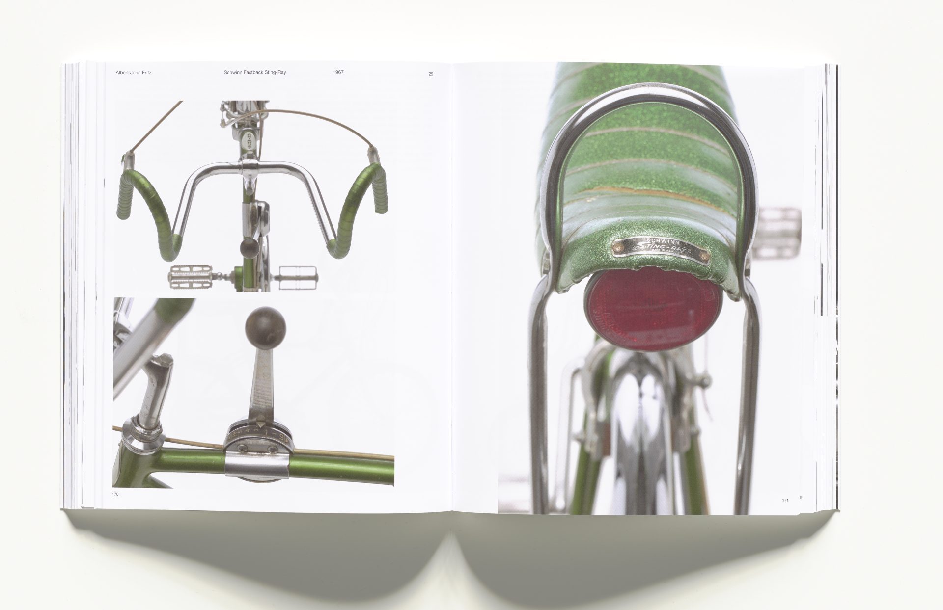 Photo shows an open exhibition catalogue with close-ups of a green bicycle.