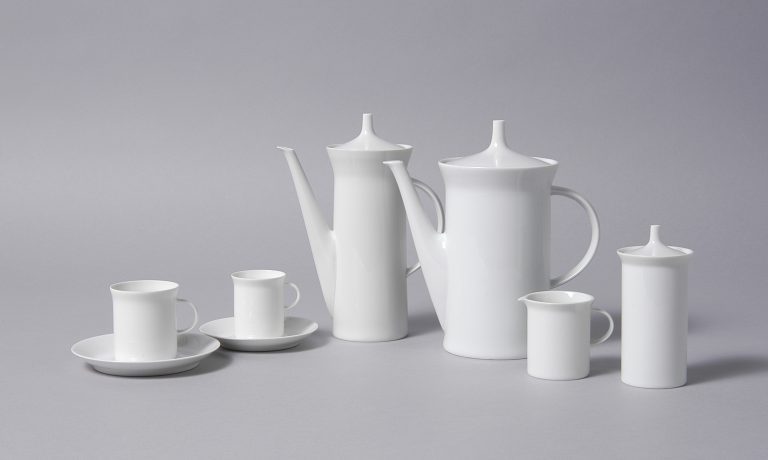 A six-piece white ceramic tea service.