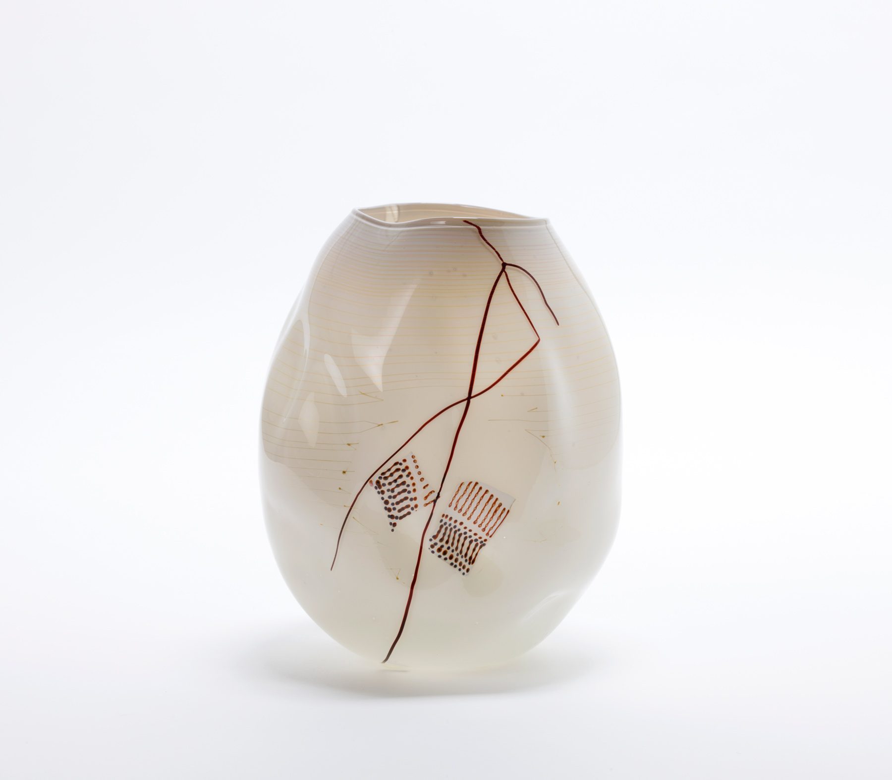 Vase with an organic, asymmetrical shape, cream-coloured surface and fine, abstract line and dot patterns.